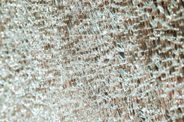 The background is made of broken glass into small pieces. Reflection of the sun's rays from the surface.