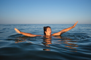 woman swims in the sea