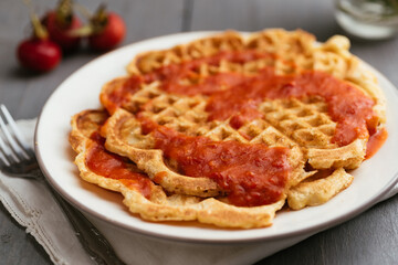 Home made vegan waffles with rose hip syrup.