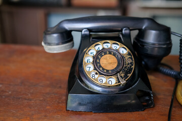 old telephone on wooden table, vintage