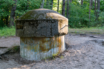 Old small concrete infantry sniper post in the woods of Hel, Poland. Old military fortification...