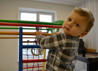 Beautiful baby boy with child face posing photographer
