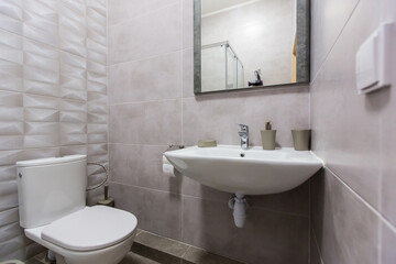 Fototapeta na wymiar bathroom with shower, bathtub and light tiles