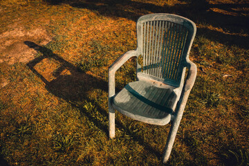 Rustic weathered chair on the lawn