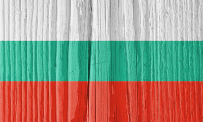 The flag of Bulgaria on dry cracked wooden surface. It seems to flutter in the wind. Bright...