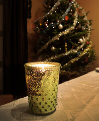 New Year and Christmas decorations. Burning a decorative candle with a Christmas tree    