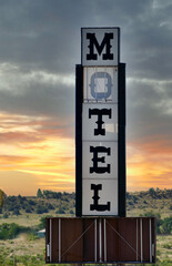 abandoned motel sign in the desert