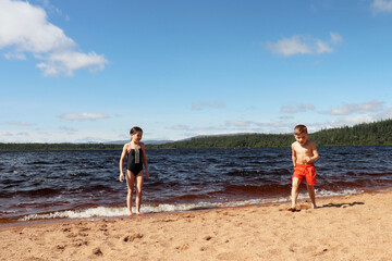 children running on the loch morlich beach