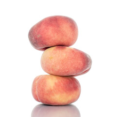 Three juicy organic peaches, close-up, isolated on white.
