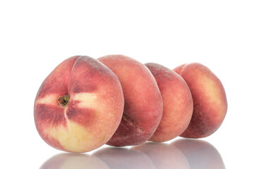 Several juicy organic peaches, close-up, isolated on white.