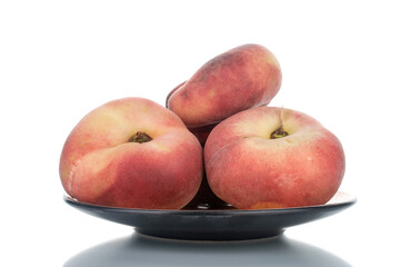 Naklejka na ściany i meble Several juicy organic peaches with ceramic dishes, close-up, isolated on white.