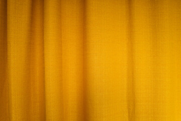 Fabric yellow curtains with folds . Abstract background, curtain, drapes gold fabric.