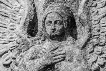 Old stone angel monument in the cemetery