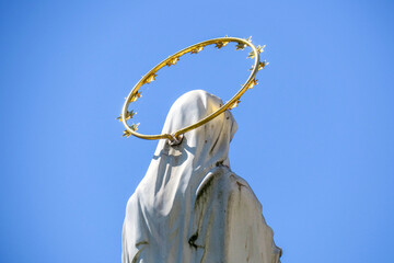 Sculpture of the Mother of God with a halo on her head