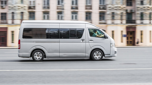Silver Toyota HiAce LWB van at the city street, side view. Fifth generation (H200) of light commercial van produced by the Japanese automobile manufacturer Toyota.