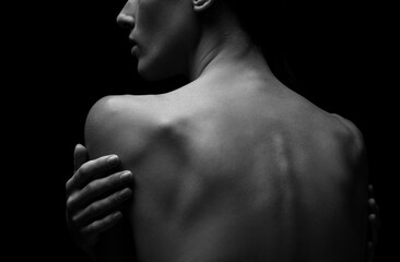 Black-white silhouette of female shoulders and hands . Female silhouette.
