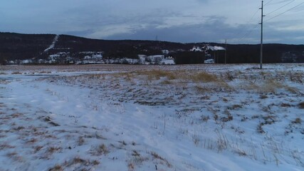 Low Level Flight Across a Snow-Covered Wheat Field