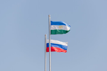 Russia and Bashkiria flag. Two flags against the sky.