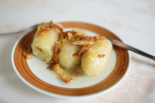 Lithuanian cepelinai, dumplings made of grated and riced potatoes and stuffed with ground meat, dry curd cheese or mushrooms.