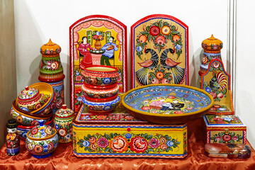 Items of traditional folk art craft "Gorodetsky painting" at the exhibition-fair of folk art crafts of Russia "LADYA" in Moscow. Russia