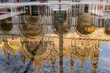 Reflection of St. Mark's Basilika in Venice / Italy