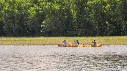 People are enjoying fishing and boating on a sunny day on Crane Lake, Voyageurs National Park, Minnesota