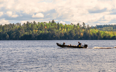 People are enjoying fishing and boating on a sunny day on Crane Lake, Voyageurs National Park,...
