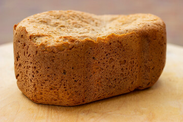 Freshly baked loaf of homemade bread close up