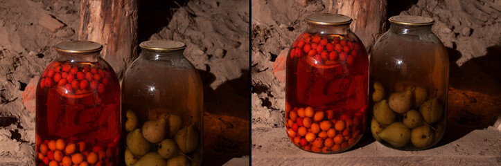 Two glass jars with compote of pears and apricots stand side by side on a wooden shelf in a rustic...