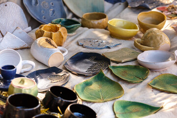 Ukrainian pottery. Pottery museum in Ukrainian village Oposhnya, center of Ukrainian pottery production. Different pottery products: bowls, pitchers, plates in museum.