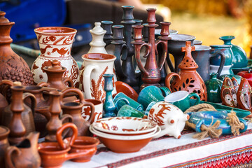 Ukrainian pottery. Pottery museum in Ukrainian village Oposhnya, center of Ukrainian pottery production. Different pottery products: bowls, pitchers, plates in museum.