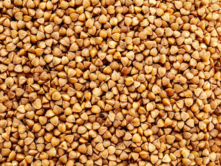 Buckwheat, buckwheat groats, as well as porridge from this cereal, background, close-up