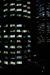 Fototapeta na wymiar Office Buildings at night with lightened windows