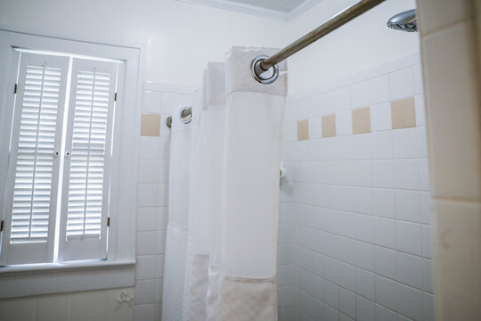 white bathroom shower with vintage tile in old cottage