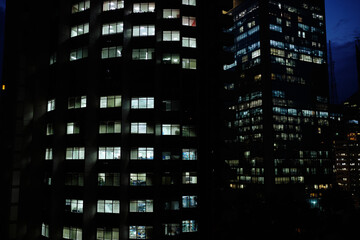 Office Buildings at night with lightened windows