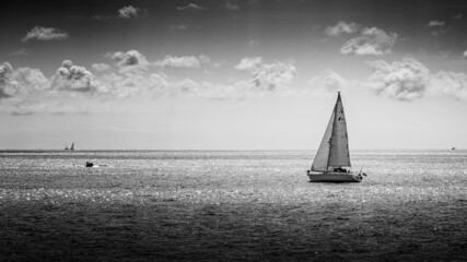 Sailing boat on the Sea in Black and White, Torcross, Devon, England, United Kingdom