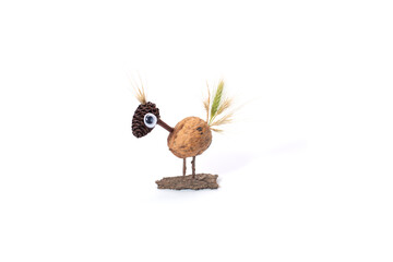 funny bird character made by child from natural material, autumn craft for preschooler