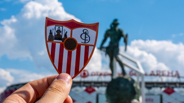 June 14, 2021 Seville, Spain. The emblem of the football club Sevilla FC against the background of a modern stadium.