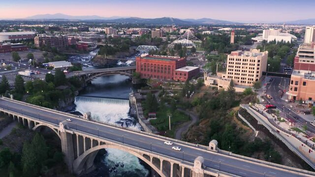 Aerial: City skyline, Monroe Street Bridge and Spokane River at sunset, Spokane, Washington, USA