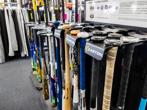 Woodinville, WA USA - circa June 2021: Angled view of baseball bats for sale at a Play It Again Sports.