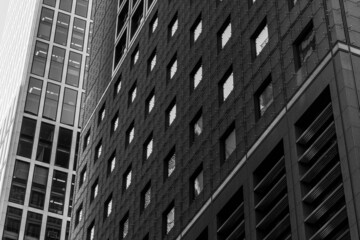 Black and white tone, Exterior architectural detail modern facade of High-rise office buildings. Abstract Urban metropolis background.
