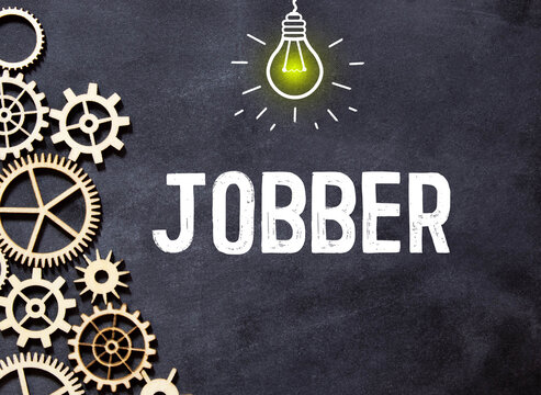 word Jobber on black background, concept business
