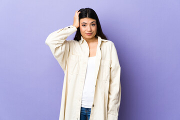 Young brunette woman over isolated purple background with an expression of frustration and not understanding