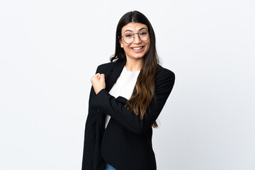 Business woman over isolated white background celebrating a victory