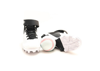 A pair of baseball cleats, baseball shoes for kids with training ball isolated on white background