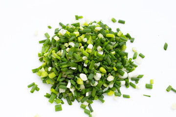 chopped spring onions on white background