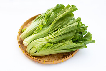 Mustard Green in bamboo basket on white background.