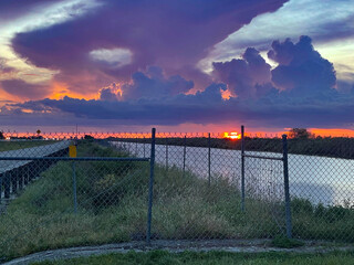 Swamp sunset and hurricane clouds