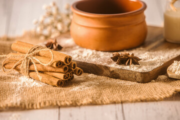 Cinnamon sticks on wooden background