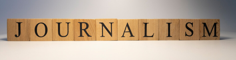 The word Journalism was created from wooden cubes. writing and journalism.